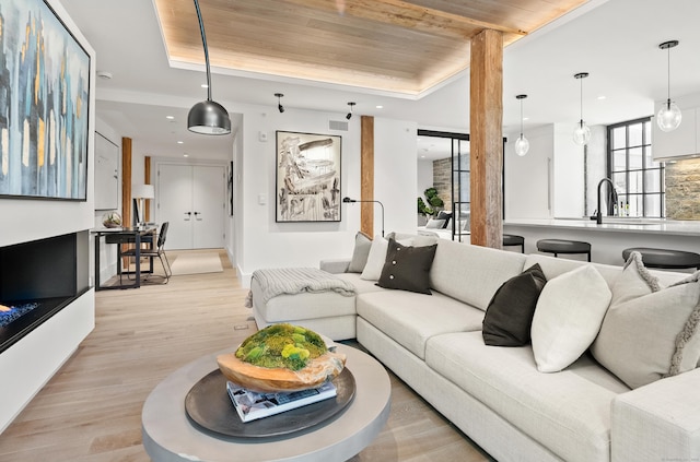 41 Richmondville Ave Unit 206, Westport, CT 06880 - living area featuring a raised ceiling, wooden ceiling, light wood-type flooring, and recessed lighting