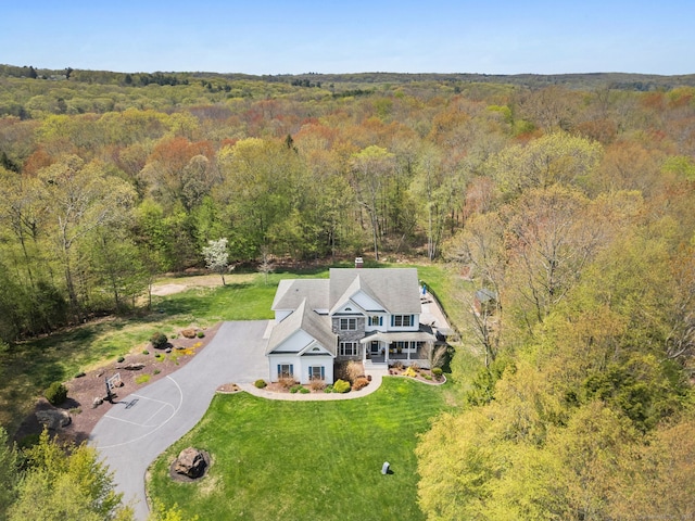 view from above of property with a forest