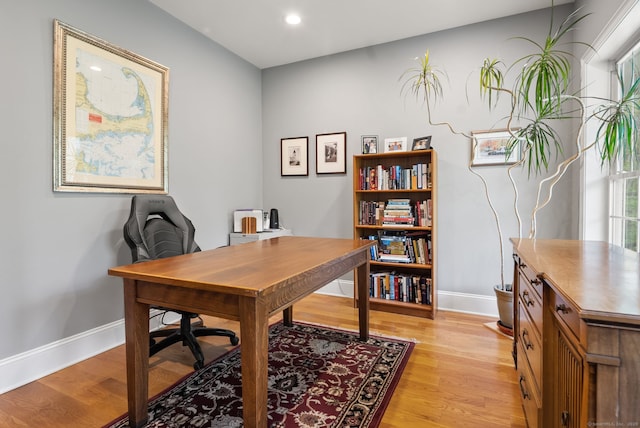 office with baseboards, light wood finished floors, and recessed lighting