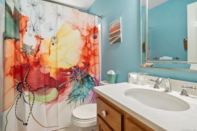full bathroom with toilet, vanity, and a shower with curtain