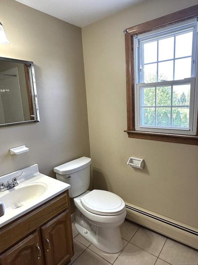 bathroom featuring tile patterned floors, baseboard heating, vanity, and toilet