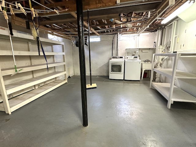 unfinished below grade area featuring a sink and washer and dryer