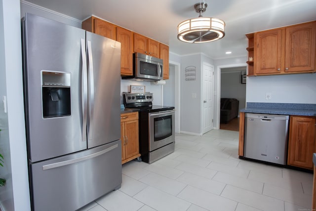 kitchen with dark countertops, brown cabinetry, and stainless steel appliances