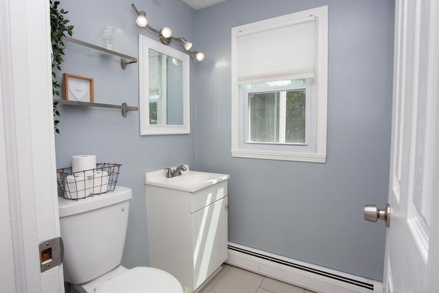 bathroom featuring toilet, baseboard heating, tile patterned flooring, and vanity
