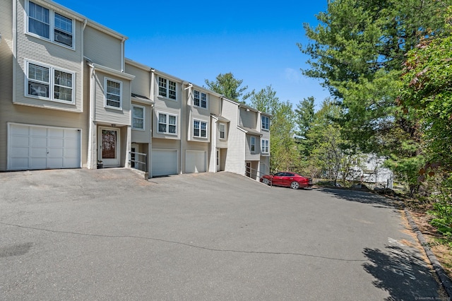 25 Deerwood Ln Unit 8, Waterbury, CT 06704 - view of building exterior with a residential view