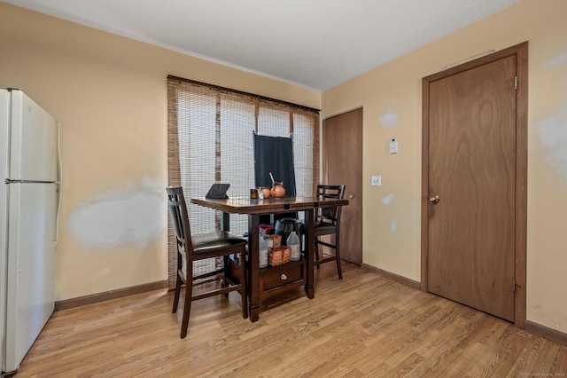 25 Deerwood Ln Unit 8, Waterbury, CT 06704 - dining space featuring baseboards and light wood-style floors