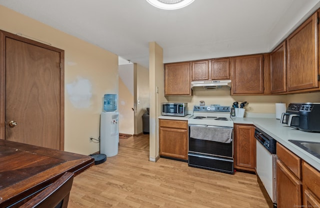 25 Deerwood Ln Unit 8, Waterbury, CT 06704 - kitchen with dishwasher, light countertops, electric stove, stainless steel microwave, and under cabinet range hood