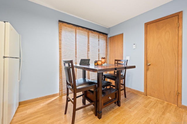 25 Deerwood Ln Unit 8, Waterbury, CT 06704 - dining room featuring light wood-type flooring and baseboards