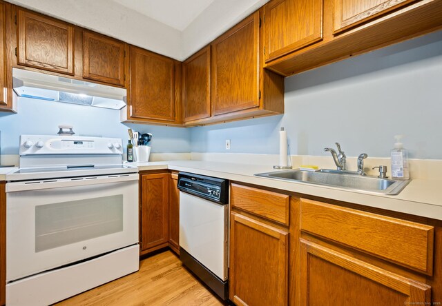 25 Deerwood Ln Unit 8, Waterbury, CT 06704 - kitchen with white appliances, under cabinet range hood, a sink, and light countertops
