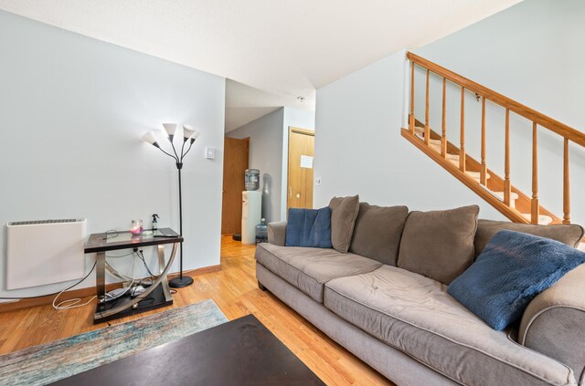 25 Deerwood Ln Unit 8, Waterbury, CT 06704 - living room featuring wood finished floors, stairs, and baseboards