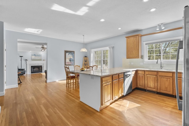 6 Old Farm Rd, Woodbridge, CT 06525 - kitchen with a sink, light wood finished floors, appliances with stainless steel finishes, and a peninsula