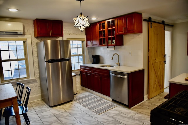 72 Sims St, Bridgeport, CT 06604 - kitchen with stainless steel appliances, a sink, dark brown cabinets, an AC wall unit, and a barn door