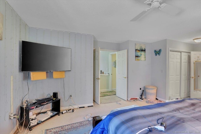 bedroom featuring baseboards, ceiling fan, and a closet