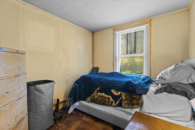 bedroom with hardwood / wood-style floors