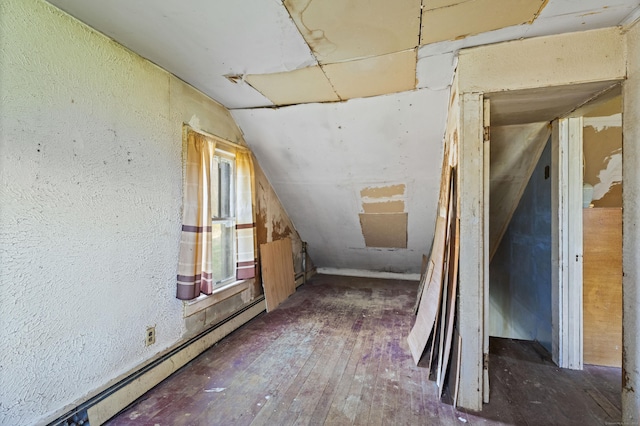 unfinished attic with a baseboard radiator
