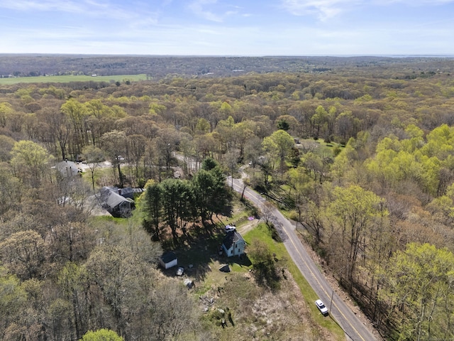 drone / aerial view featuring a view of trees