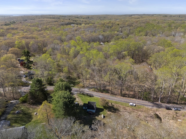 birds eye view of property with a wooded view