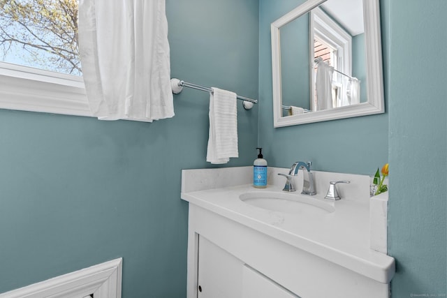 bathroom with a healthy amount of sunlight and vanity