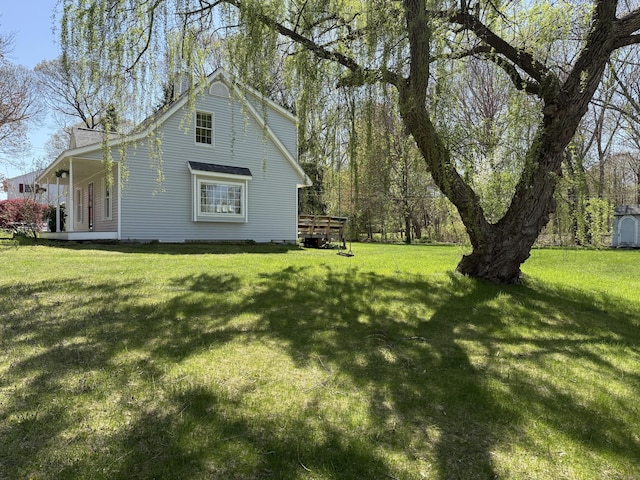view of home's exterior with a lawn
