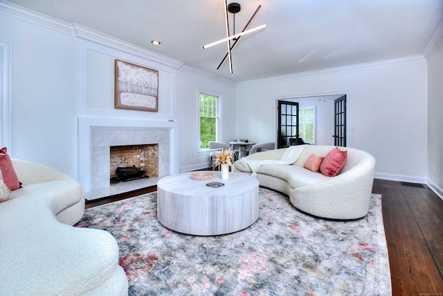 9 November Trl, Weston, CT 06883 - living area featuring plenty of natural light, dark wood-style flooring, crown molding, a premium fireplace, and baseboards