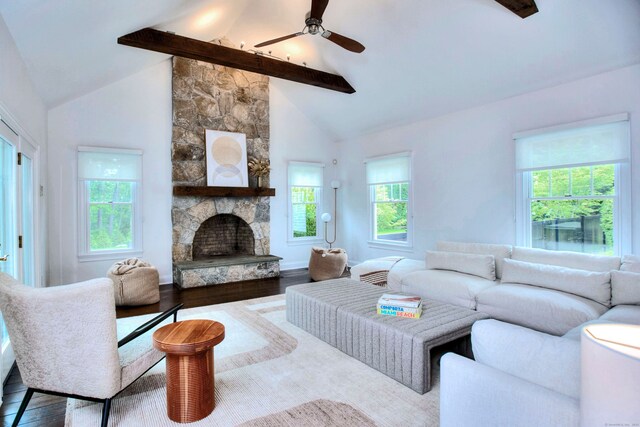 9 November Trl, Weston, CT 06883 - living area with beamed ceiling, ceiling fan, a stone fireplace, wood finished floors, and high vaulted ceiling