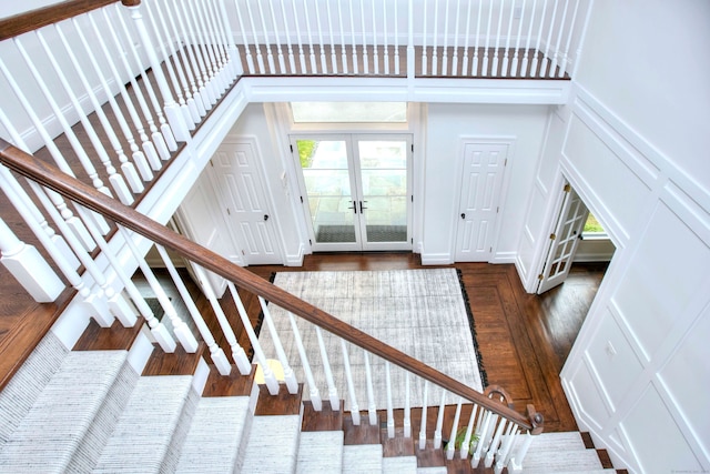 9 November Trl, Weston, CT 06883 - stairs with a decorative wall, french doors, wood finished floors, and a towering ceiling