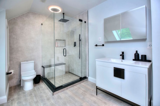 9 November Trl, Weston, CT 06883 - full bath featuring a skylight, vanity, a shower stall, toilet, and wood finished floors