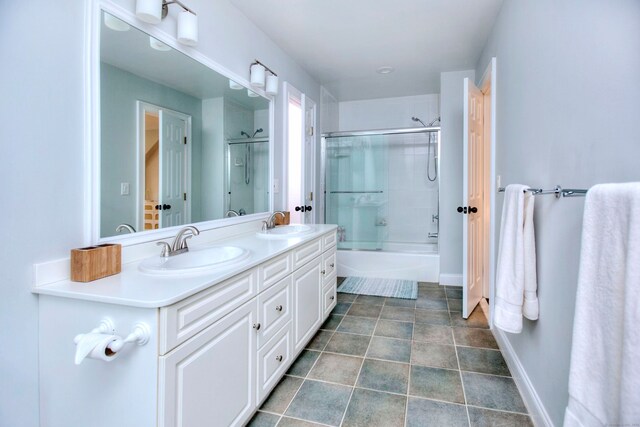 9 November Trl, Weston, CT 06883 - bathroom featuring double vanity, tub / shower combination, tile patterned flooring, and baseboards