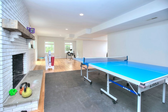 9 November Trl, Weston, CT 06883 - recreation room featuring a brick fireplace, recessed lighting, wood finished floors, and baseboards