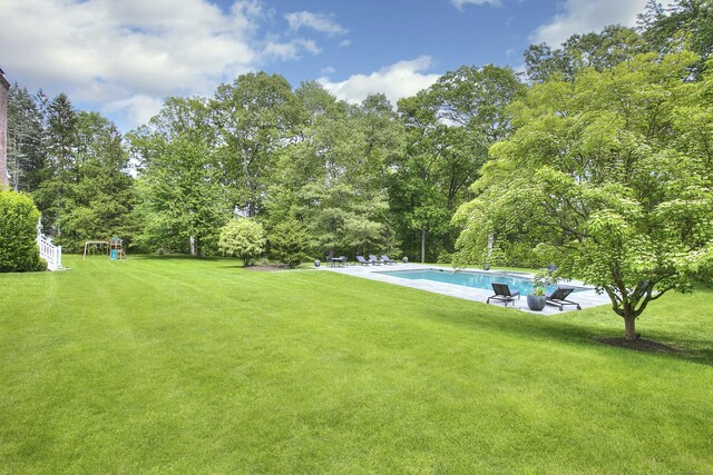 9 November Trl, Weston, CT 06883 - view of grassy yard featuring a patio and an outdoor pool