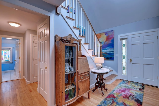 189 Red Stone Hl Unit 17, Bristol, CT 06010 - entryway with baseboards, wood finished floors, and stairway