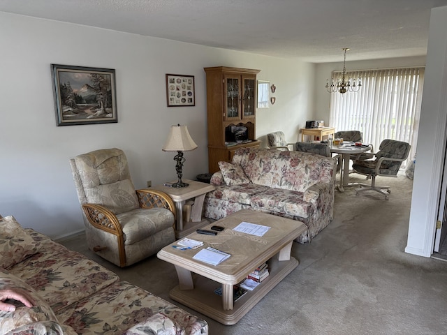 carpeted living room featuring a notable chandelier