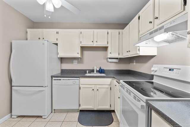 kitchen featuring white appliances, ceiling fan, under cabinet range hood, a sink, and light tile patterned floors