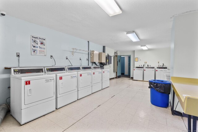 community laundry room with separate washer and dryer