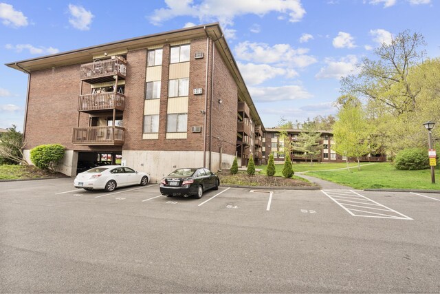 view of property featuring uncovered parking