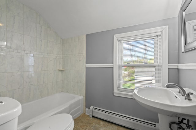 bathroom featuring toilet, baseboards, bathing tub / shower combination, lofted ceiling, and a baseboard radiator