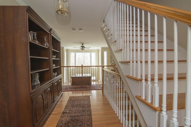 hall with stairs and light wood-type flooring