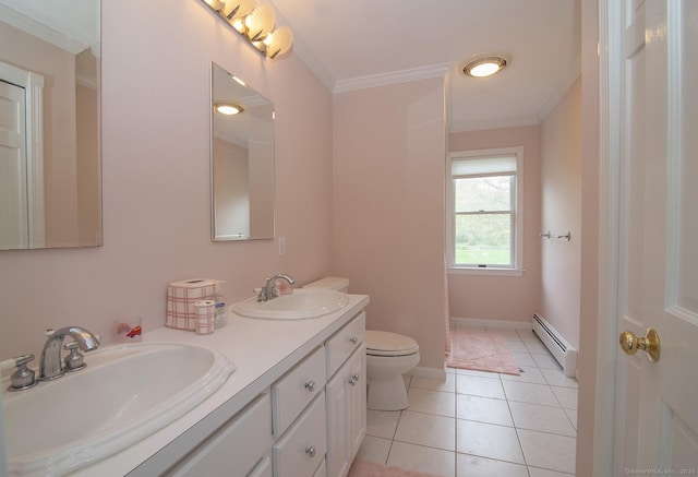 bathroom featuring toilet, ornamental molding, baseboard heating, and a sink