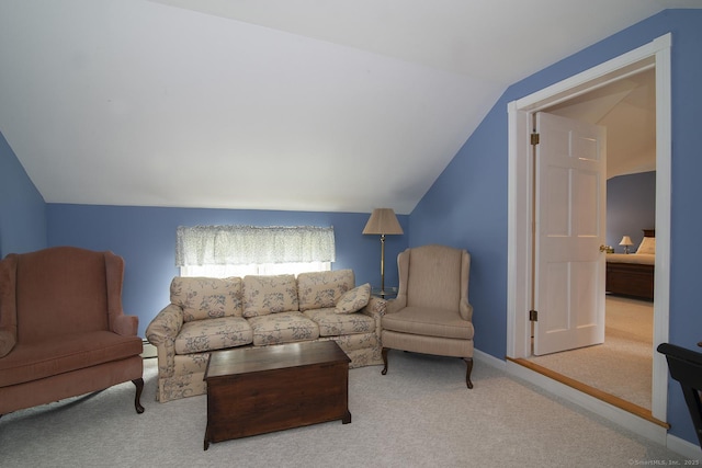 carpeted living area featuring vaulted ceiling