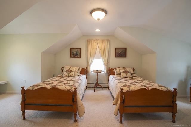 bedroom featuring vaulted ceiling, light colored carpet, baseboards, and baseboard heating