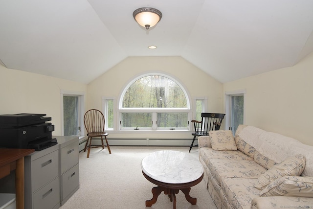 living area featuring vaulted ceiling, a baseboard heating unit, and light carpet