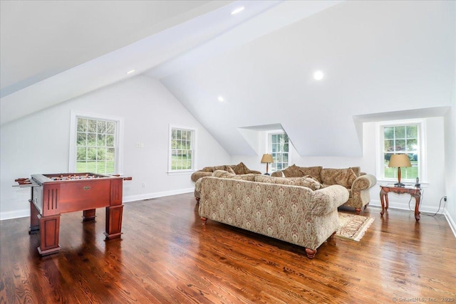 6 E Starrs Plain Rd, Danbury, CT 06810 - living area with dark wood-style floors, vaulted ceiling, healthy amount of natural light, and baseboards