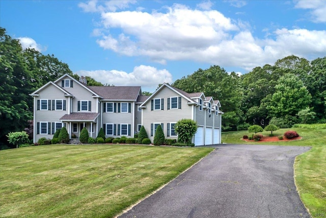 6 E Starrs Plain Rd, Danbury, CT 06810 - view of front of property with a garage, asphalt driveway, a chimney, and a front yard