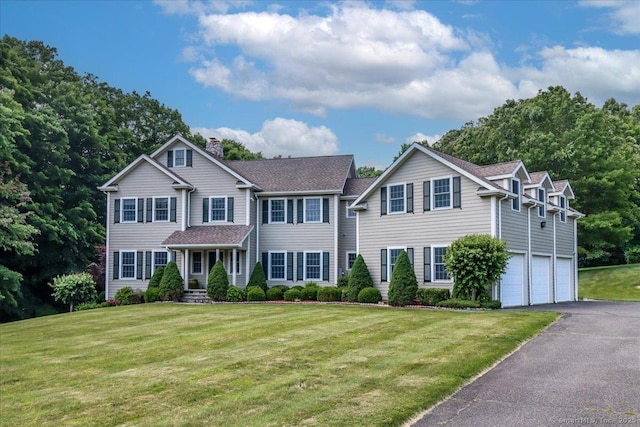 6 E Starrs Plain Rd, Danbury, CT 06810 - view of front facade with a chimney, driveway, an attached garage, a front lawn, and roof with shingles