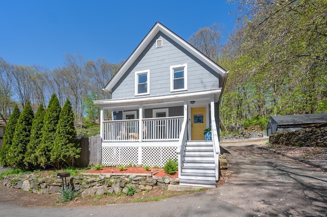 10 Gilmour St, Norwich, CT 06360 - bungalow featuring covered porch, stairs, and aphalt driveway