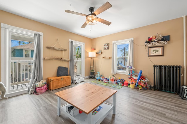 10 Gilmour St, Norwich, CT 06360 - rec room with a ceiling fan, plenty of natural light, and radiator heating unit