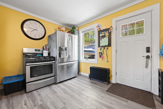 10 Gilmour St, Norwich, CT 06360 - kitchen featuring appliances with stainless steel finishes, radiator heating unit, baseboards, light wood-type flooring, and ornamental molding