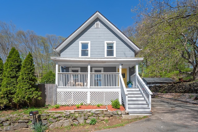 10 Gilmour St, Norwich, CT 06360 - bungalow-style house with a porch, fence, and stairway