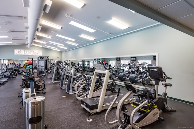 workout area with vaulted ceiling