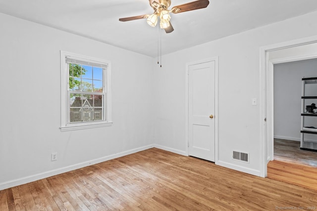 unfurnished bedroom with light wood-style floors, baseboards, and ceiling fan